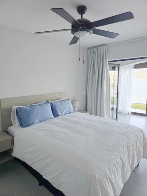 queen-sixed bed with side tables